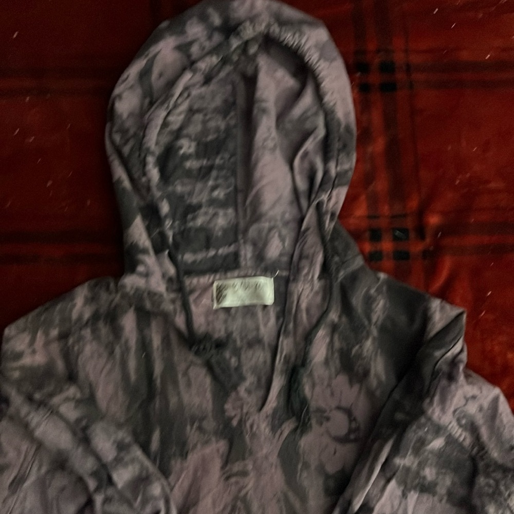 Bali-Kon cotton pull over with drawstring hood and front pocket.